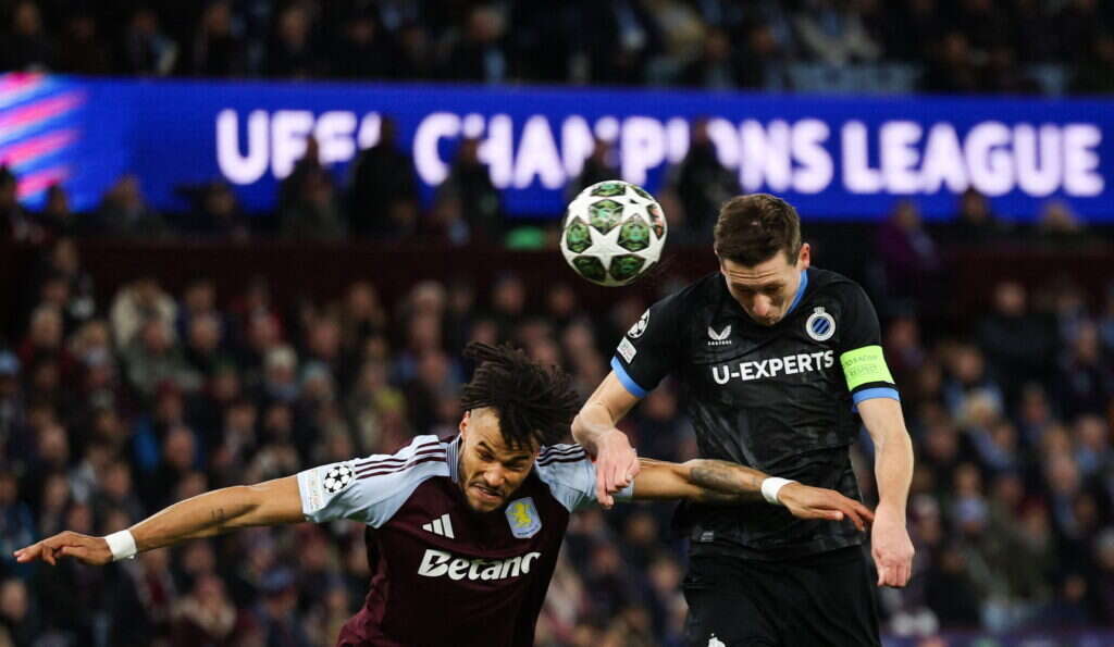 TOPSHOT - Aston Villa's English defender #05 Tyrone Mings (L) fights for the ball with Club Brugge's Belgian midfielder #20 Hans Vanaken during the last 16 second leg UEFA Champions League football match between Aston Villa and Club Brugge at Villa Park in Birmingham, central England on March 12, 2025. (Photo by Adrian Dennis / AFP)