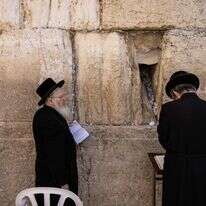 מתפללים חרדיים בכותל | AFP