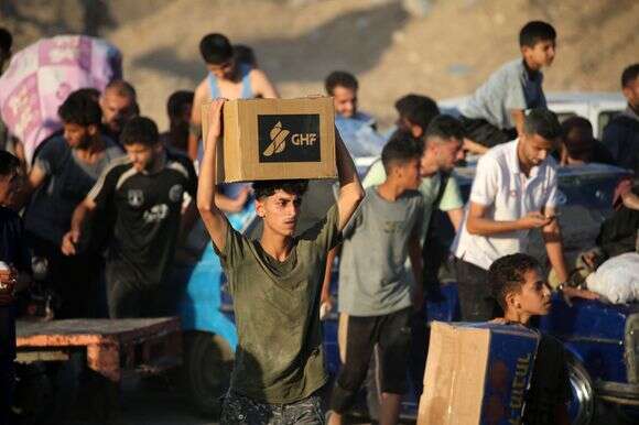 עזתים סמוך לאחד ממרכזי החלוקה של GHF | AFP עזתים סמוך לאחד ממרכזי החלוקה של GHF | AFP
