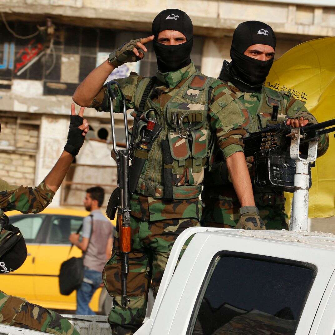 אנשי מליציית "גדודי חיזבאללה" בעיראק | איי.אף.פי אנשי מליציית "גדודי חיזבאללה" בעיראק | איי.אף.פי