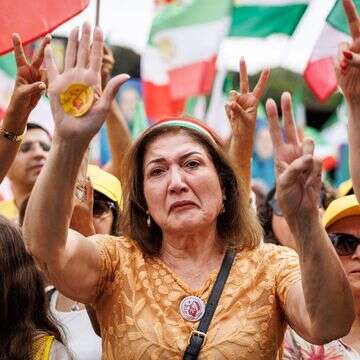 מפגינה איראנית נגד המשטר בבריסל | AFP מפגינה איראנית נגד המשטר בבריסל | AFP