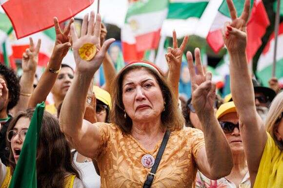 מפגינה איראנית נגד המשטר בבריסל | AFP מפגינה איראנית נגד המשטר בבריסל | AFP