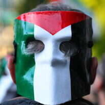 מפגין פרו־פלסטיני | Stefano RELLANDINI / AFP מפגין פרו־פלסטיני | Stefano RELLANDINI / AFP