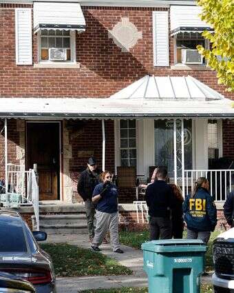 כוחות של ה-FBI למלחמה בטרור במהלך החיפוש בתא הטרור שנחשף בדירבורן, מישיגן | AFP