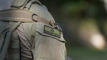 חייל צה"ל עם דגל ישראל על בגדו | אייל מרגולין, פלאש 90