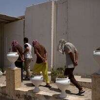 שלושה עיראקים שנידונו למוות בשל היותם לוחמים לכאורה בארגון המדינה האסלאמית | AP