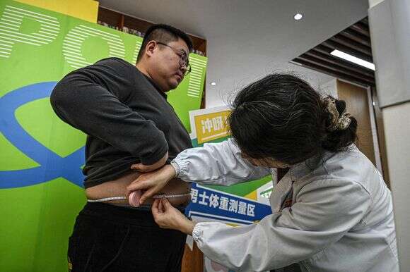 משתתפים בתוכניות לירידה במשקל בסין | AFP