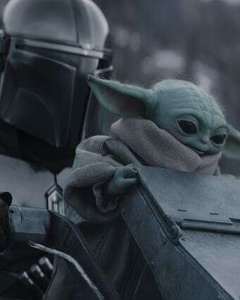 (L-R) The Mandalorian and Grogu in Lucasfilm's THE MANDALORIAN AND GROGU. Photo courtesy of Lucasfilm. © 2026 Lucasfilm Ltd™. All Rights Reserved.