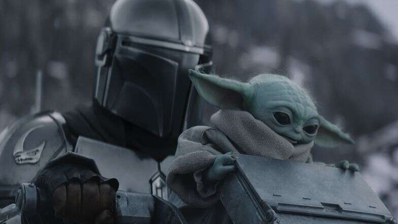 (L-R) The Mandalorian and Grogu in Lucasfilm's THE MANDALORIAN AND GROGU. Photo courtesy of Lucasfilm. © 2026 Lucasfilm Ltd™. All Rights Reserved.