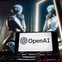 הלוגו של OpenAI מוצג בטלפון סלולרי עם תמונה על צג מחשב - שנוצרה על ידי מודל הטקסט-לתמונה של Dall-E | AP