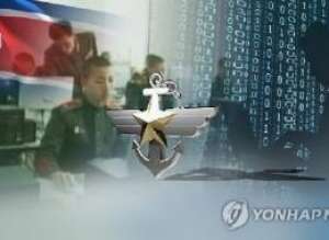 This undated captured image from Yonhap News TV shows North Korea's national flag and North Korean cyberwarfare personnel receiving training. (Yonhap) This undated captured image from Yonhap News TV shows North Korea's national flag and North Korean cyberwarfare personnel receiving training. (Yonhap)