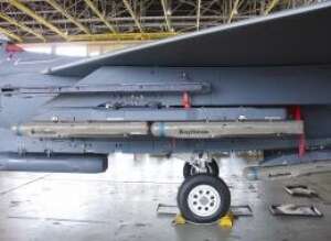Locked and loaded, the F-15E fighter aircraft can carry seven groups of four Small Diameter Bomb IIs, for a total of 28 weapon - raytheon.com Locked and loaded, the F-15E fighter aircraft can carry seven groups of four Small Diameter Bomb IIs, for a total of 28 weapon - raytheon.com
