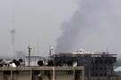 עשן עולה מזירת הפיצוצים בבגדד. עשן עולה מזירת הפיצוצים בבגדד.