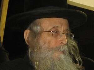 מנהיג העדה הנוכחי, הרב יצחק טוביה וייס. מנהיג העדה הנוכחי, הרב יצחק טוביה וייס.