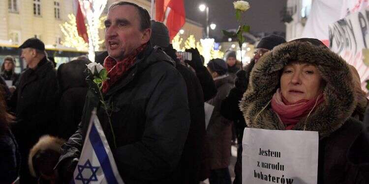 הפגנה בפולין נגד 'חוק השואה' ב-2018. צילום: AFP צילום: AFP