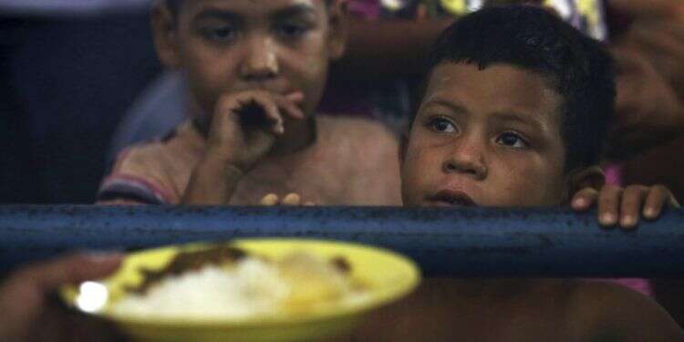 ילדים פליטים מוונצואלה בברזיל. צילום: AP צילום: AP