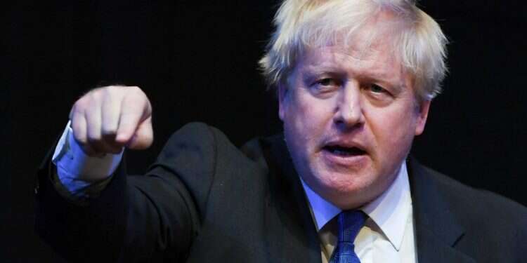 בוריס ג'ונסון נואם בוועידה השמרנית השנתית בבריטניה. צילום: AFP צילום: AFP