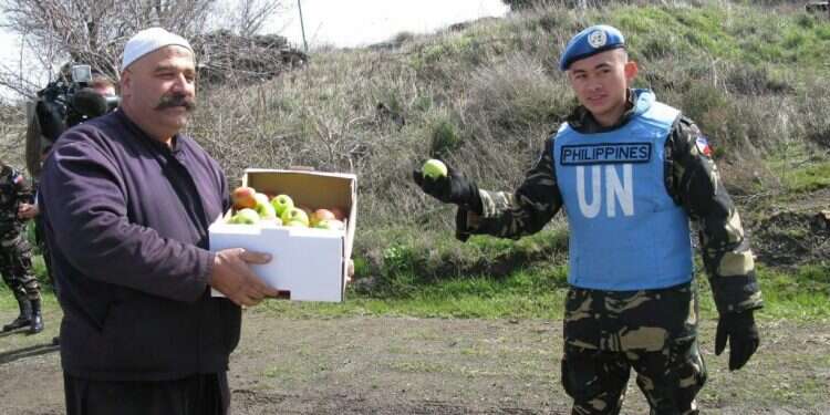 העברת תפוחים מהגולן לסוריה. צילום רם שדמון צילום רם שדמון