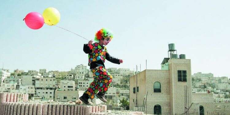 ילד בחברון, פורים 2006. צילום: רויטרס צילום: רויטרס