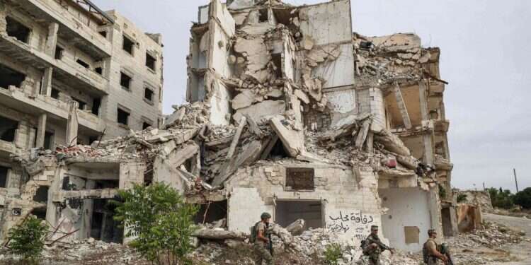 בניין שהופצץ בסוריה. צילום: AFP בניין שהופצץ בסוריה. צילום: AFP