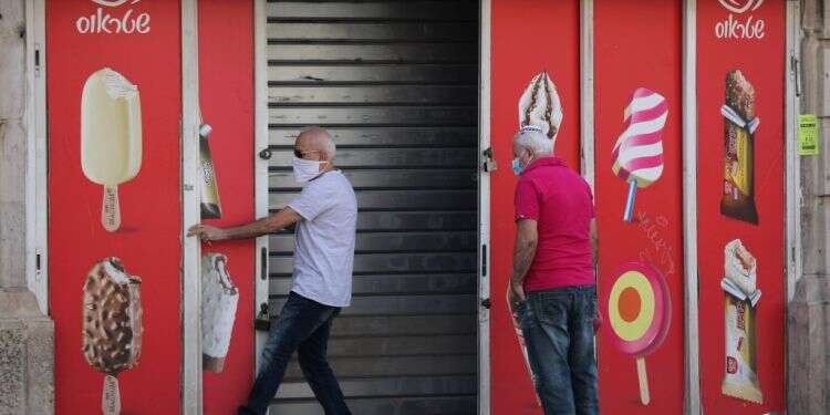 חוזרים לעבודה. צילום: EPA התו הכושל: חוסר היערכות ממשלתית שוב פוגע קשות במשק