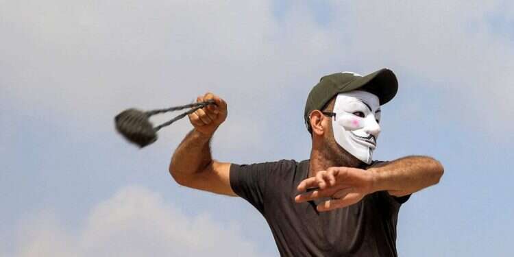 אילוסטרציה. צילום: AFP "עולם הפוך": נעצרו נערים שהותקפו באלימות בחאוורה