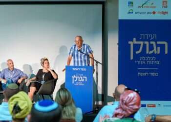 עוד דונם, עוד עז, עוד היי־טק. יהודה הראל נואם. צילום: אנצ'ו גוש ג'יני