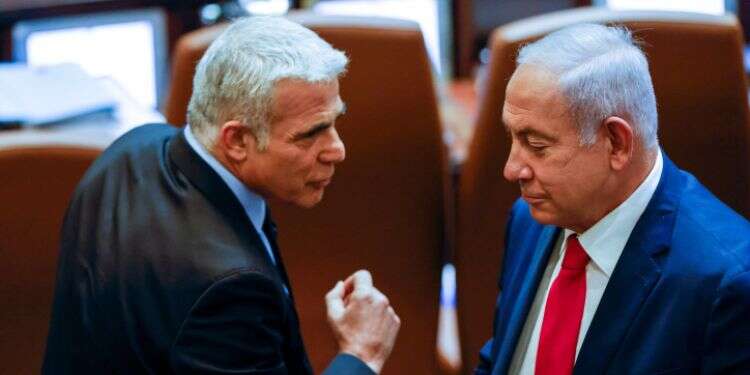 נתניהו ולפיד. צילום: אוליבייה פיטוסי, פלאש 90 רק ממשלת מרכז תמנע בחירות חוזרות