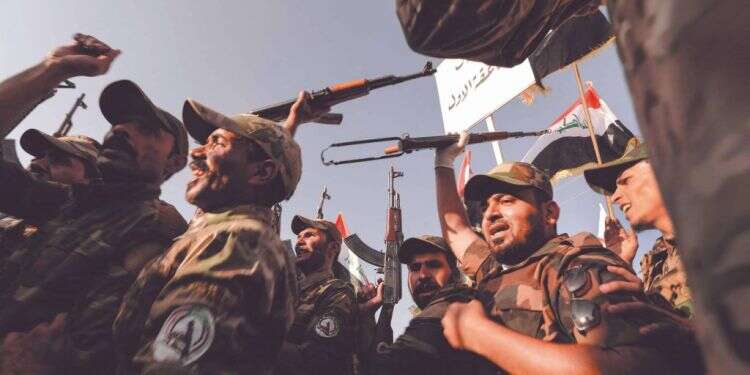 לוחמי. צילום: AFP דאעש, כוח קודס ותקציב המיליארדים: התעצמות המיליציות הפרו-איראניות בעיראק