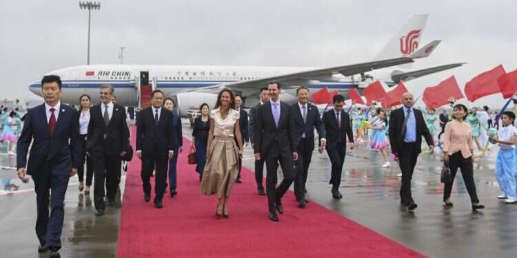 נשיא סוריה בשאר אל-אסד ורעייתו. צילום: Huang Zongzhi/Xinhua, AP לראשונה מזה 20 שנה: אסד ביקר בסין