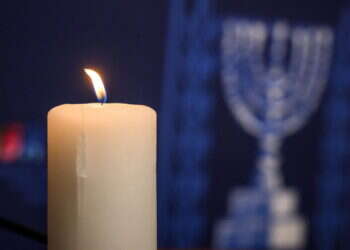 נר זיכרון בטקס לזכר ה7.10 במשרדי האו"ם בז'נבה. צילום: AFP