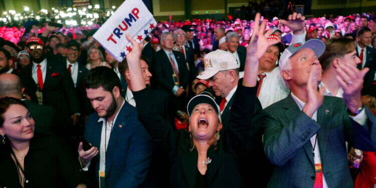 תומכי טראמפ חוגגים את ניצחונו. צילום: AFP תומכת טראמפ, צילום: Chip Somodevilla/Getty Images/AFP